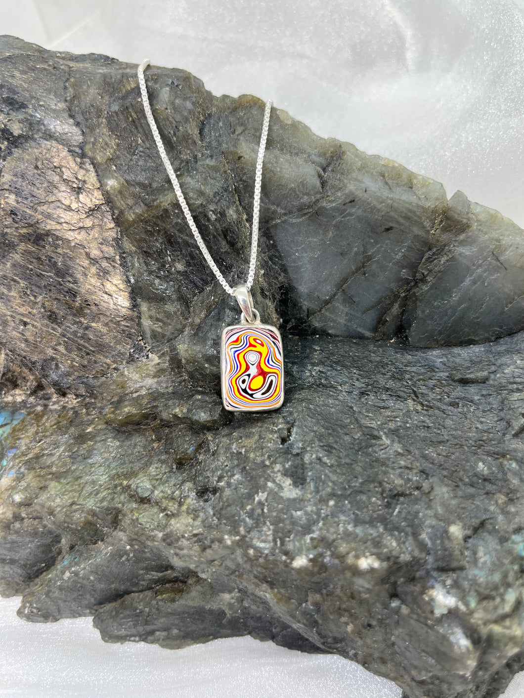 Fordite pendant